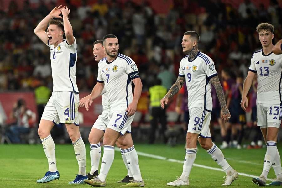 Scotland's midfielder #04 Scott McTominay celebrates scoring a goal that was later annulled 