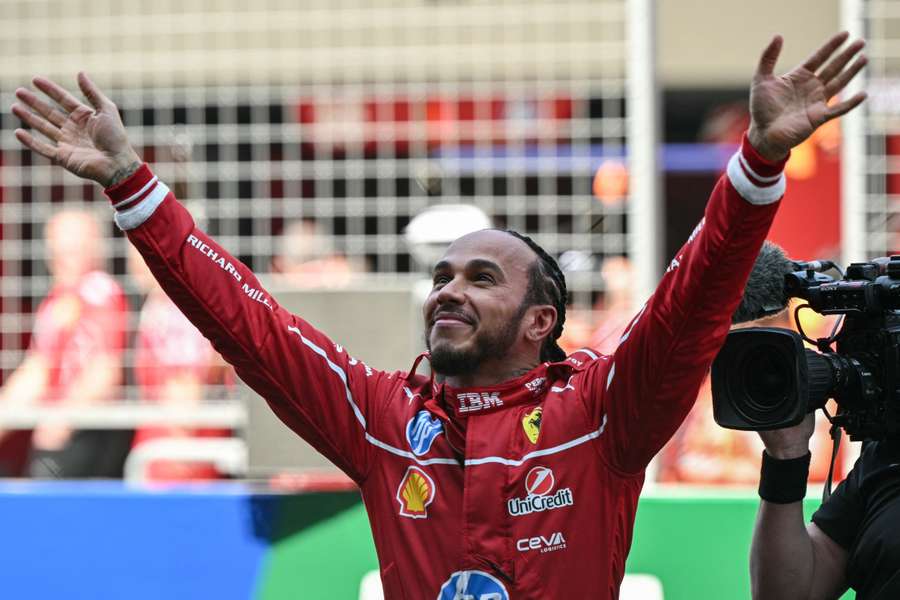 Lewis Hamilton celebrates winning the sprint race at the Shanghai International Circuit