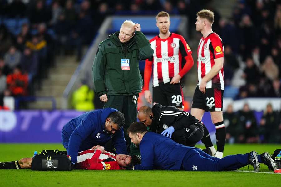 Brentford's Christian Norgaard receives treatment during the Premier League match at the King Power Stadium