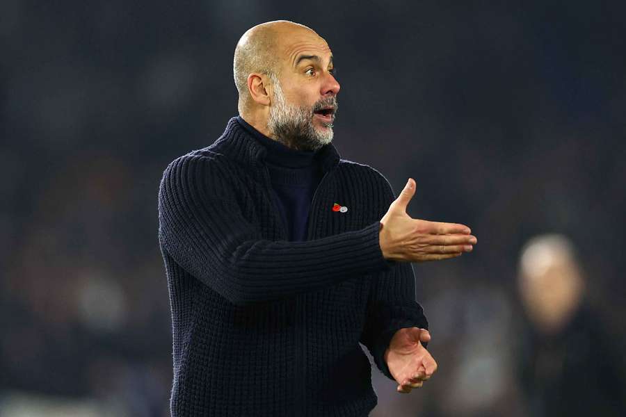 Pep Guardiola reacts during the match with Brighton