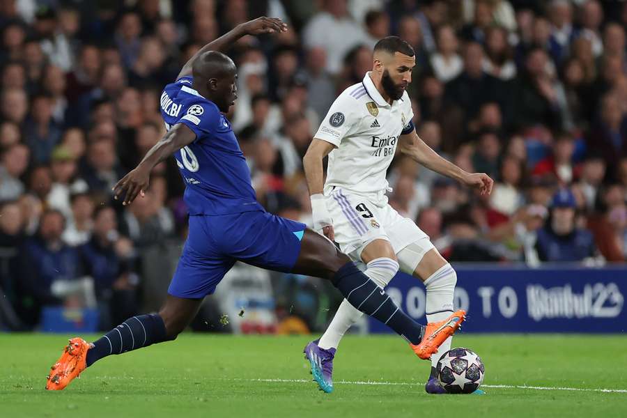 Chelsea's Senegalese defender Kalidou Koulibaly tackles Real Madrid's French forward Karim Benzema during the UEFA Champions League quarter-final