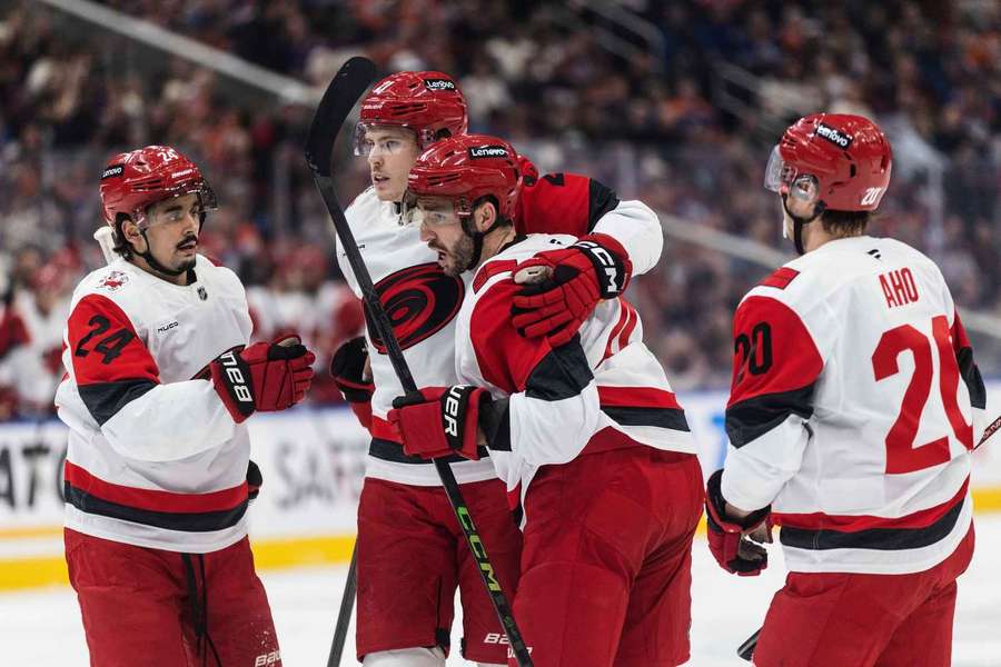 Carolina Hurricanes players celebrate 40th win of 2025-2026 season