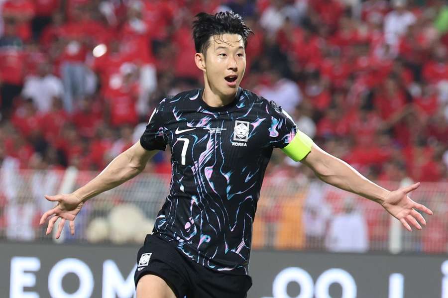 Son Heung-min celebrates scoring against Oman in October