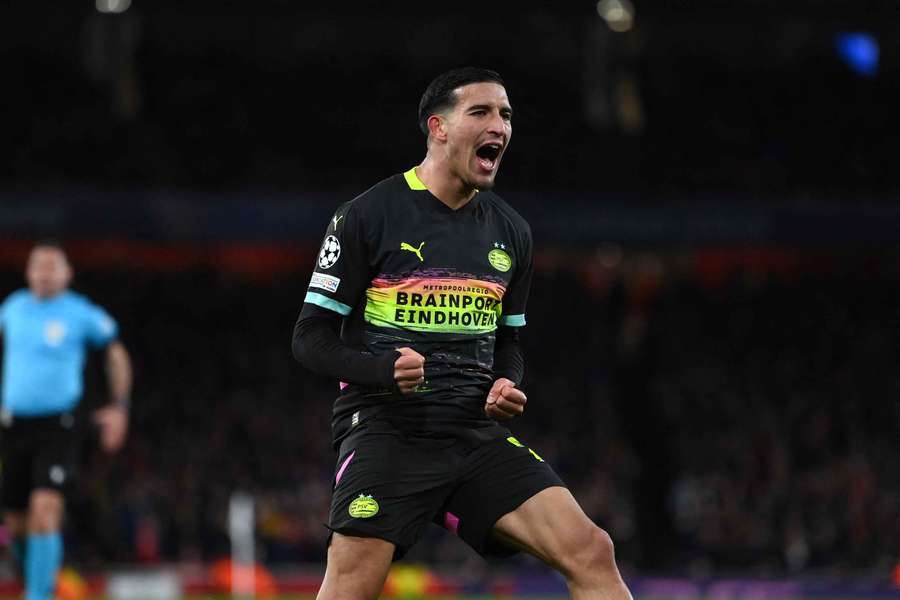 PSV's Couhaib Driouech celebrates scoring the 2-2 against Arsenal