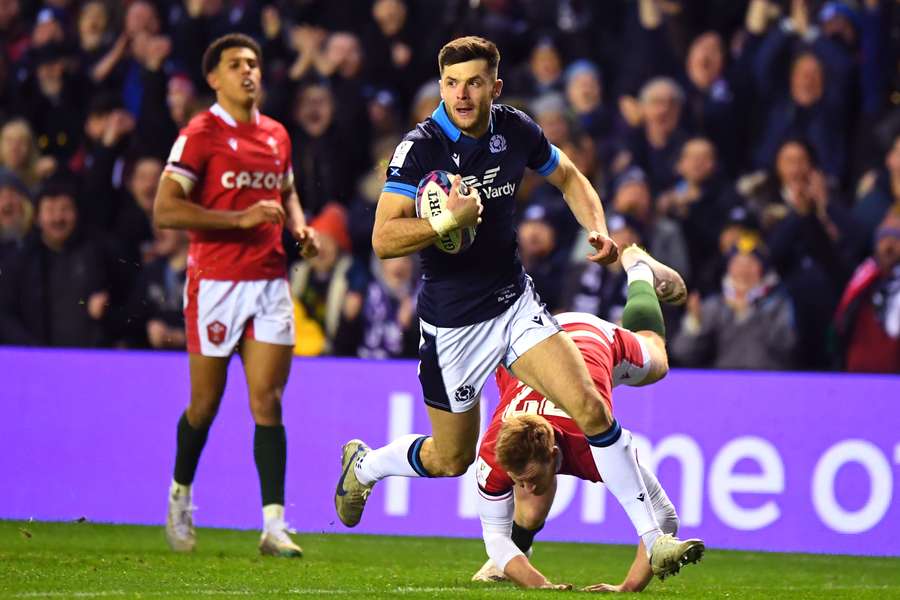 Scotland's Blair Kinghorn runs in a try during the Six Nations international rugby union match between Scotland and Wales 