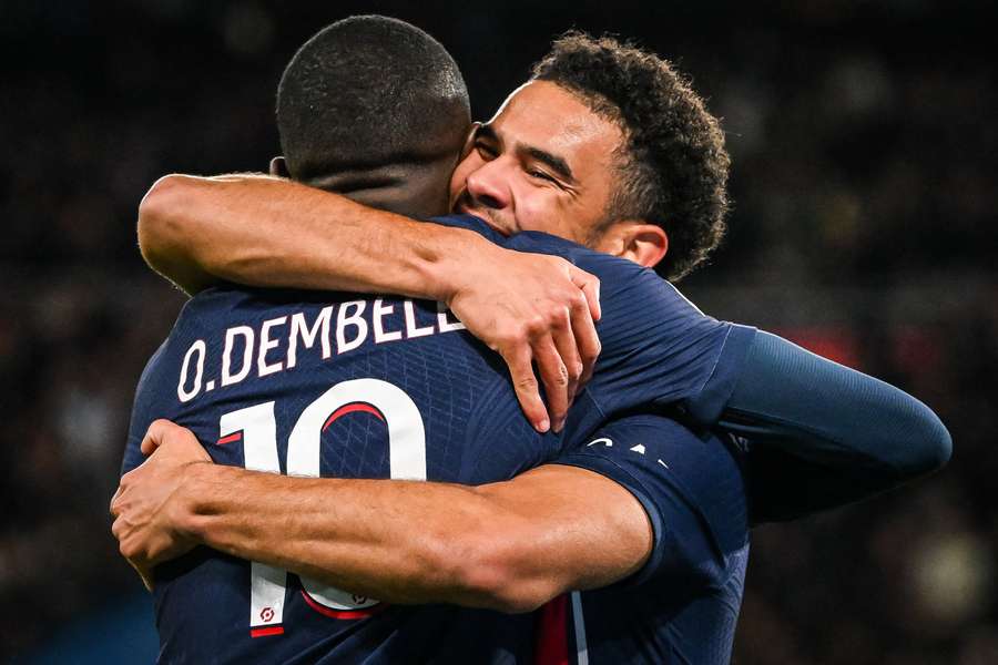 Warren Zaire-Emery celebrates scoring his team's second goal with Paris Saint-Germain's French forward Ousmane Dembele 