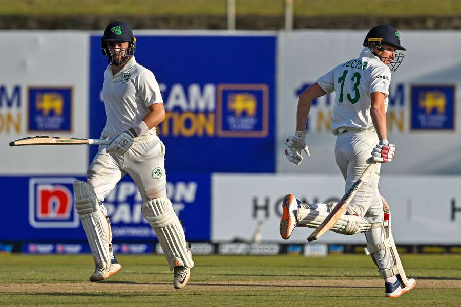 Ireland's Harry Tector (R) and Andrew Balbirnie run between the wickets