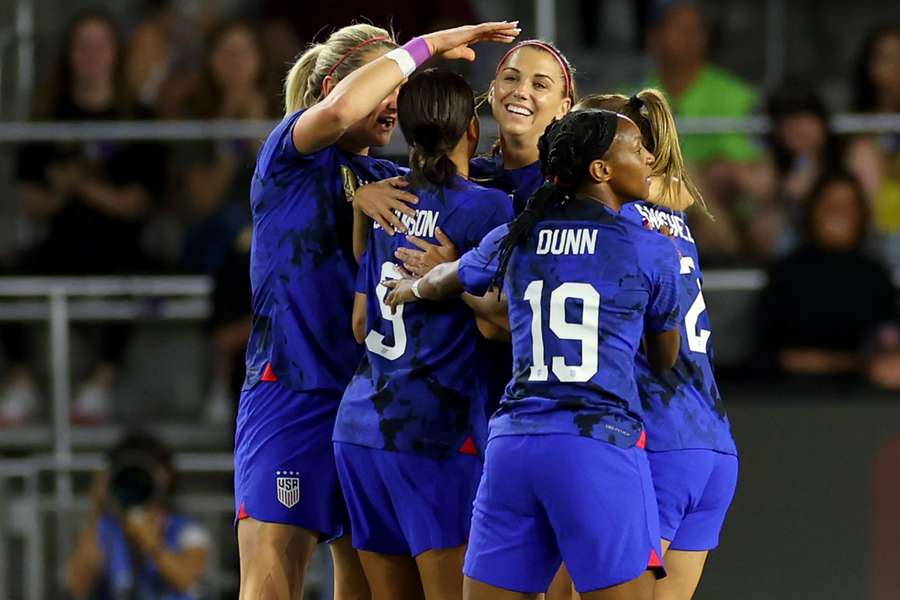 USA's players celebrate their second goal against Canada