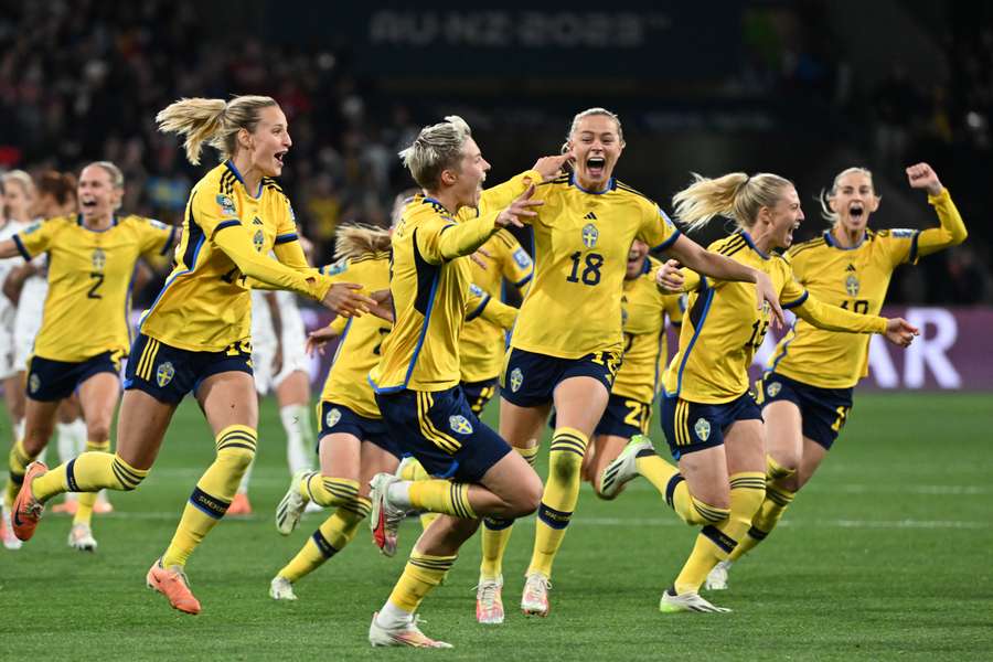 Sweden players celebrate after their final penalty