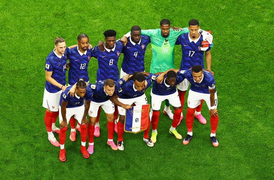France players pose for a team group photo before the match