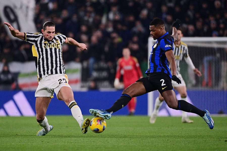 Juventus' Adrien Rabiot and Inter's Denzel Dumfries in action