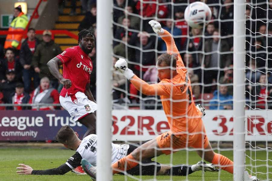 Wrexham's Jacob Mendy scores their second goal against Notts County
