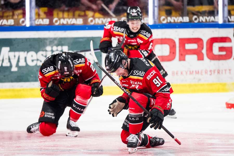 Brian O'Neill and his Lulea teammates celebrate his second goal of the game