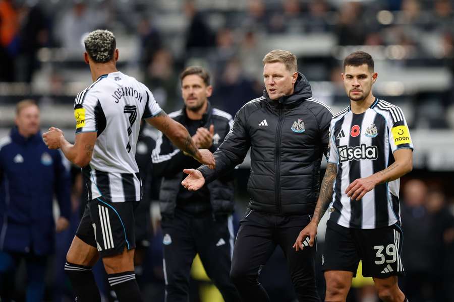 Newcastle United manager Eddie Howe with Joelinton and Bruno Guimaraes Newcastle United manager Eddie Howe with Joelinton and Bruno Guimaraes