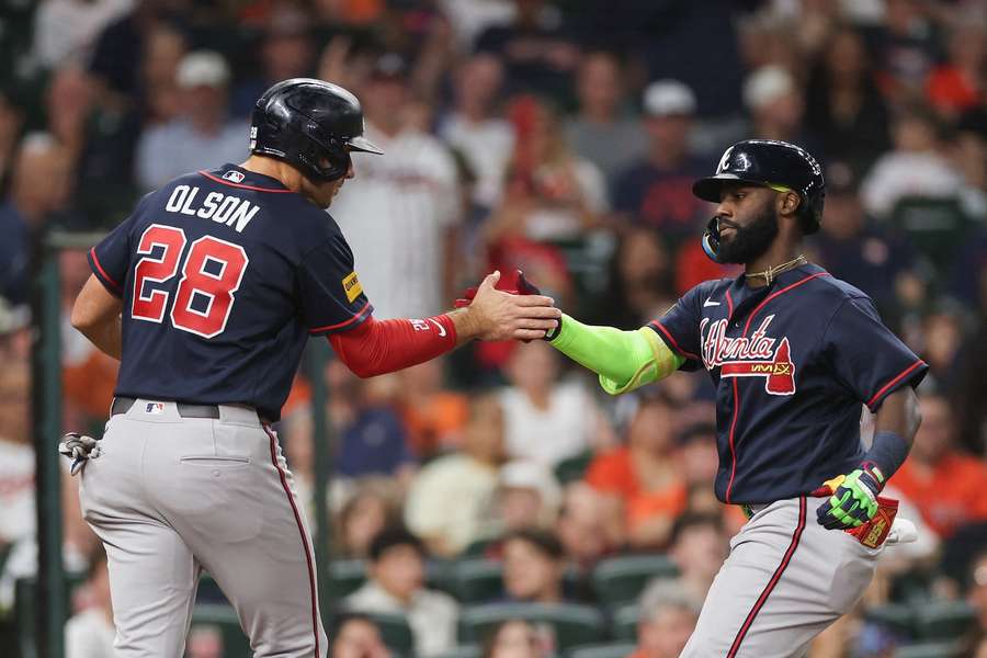 Atlanta Braves Matt Olson and Michael Harris II celebrating a home run Atlanta Braves Matt Olson and Michael Harris II celebrating a home run
