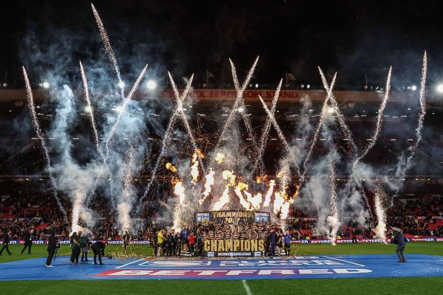 Wigan Warriors lift the Betfred Super League Grand Final trophy