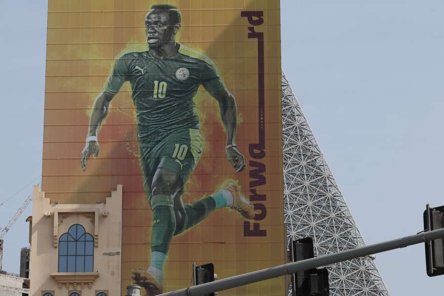 A large picture of Senegal's Sadio Mane is displayed on a building in Doha