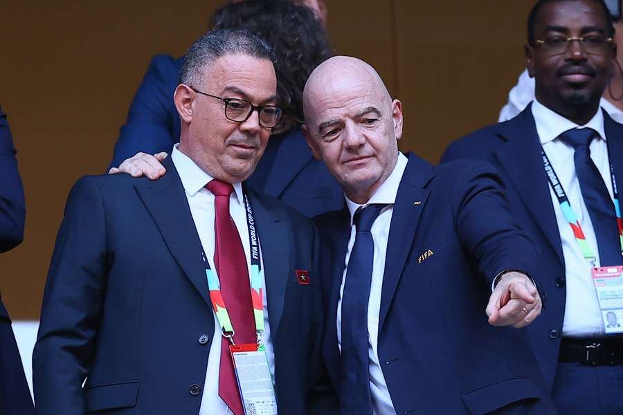 Fouzi Lekjaa of Morocco alongside Gianni Infantino at the 2026 World Cup