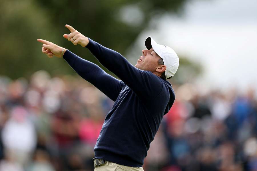 Rory McIlroy reacts to a missed birdie putt on the 12th green Rory McIlroy reacts to a missed birdie putt on the 12th green