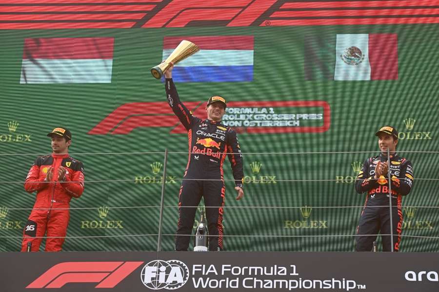 Verstappen (C) celebrates his win