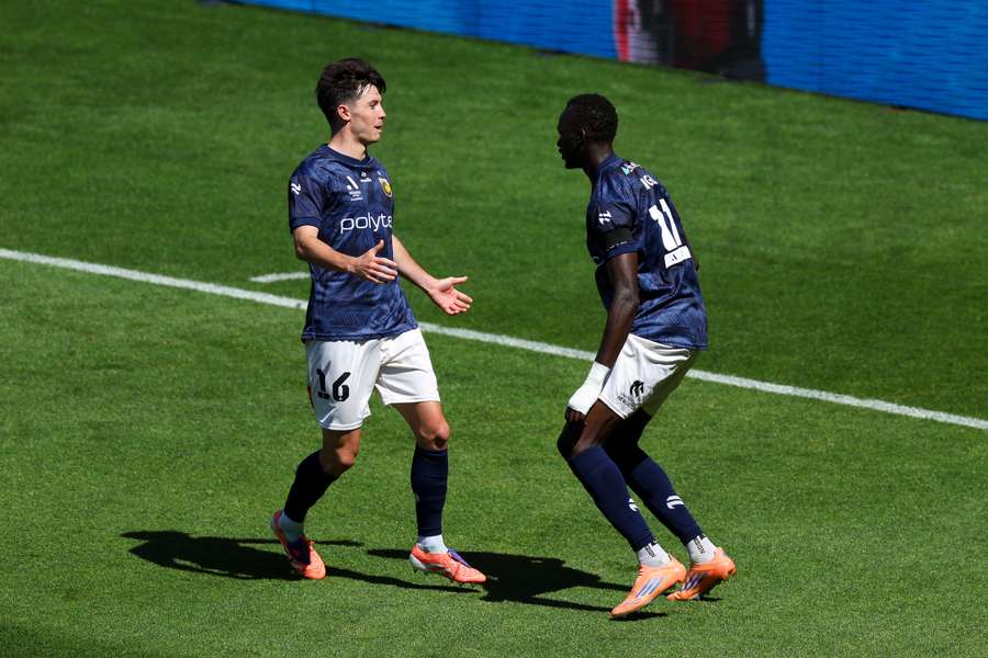 Central Coast Mariners' Sabit Ngor celebrates his goal against the Phoenix. 