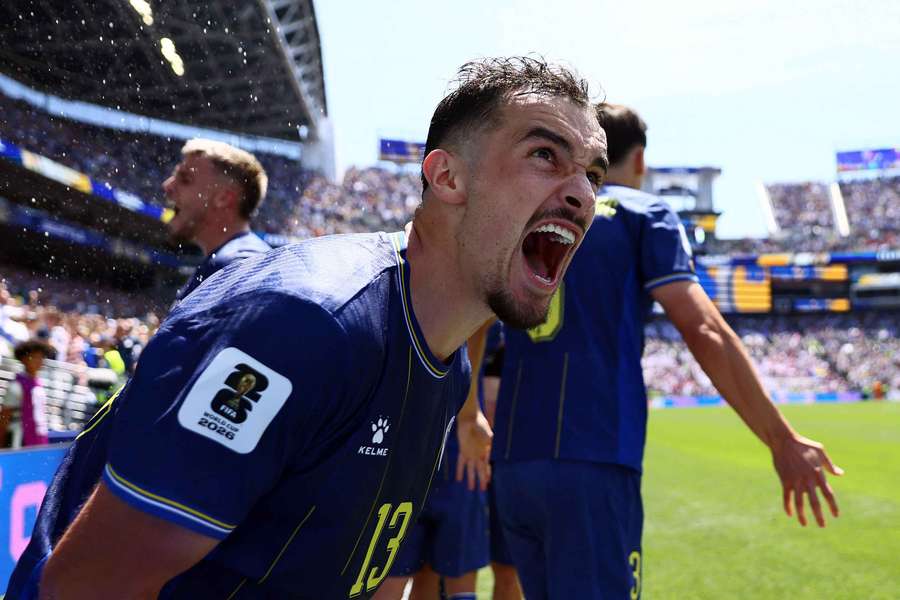 Bosnia and Herzegovina's Ivan Basic celebrates their third goal scored by Ermin Mahmic
