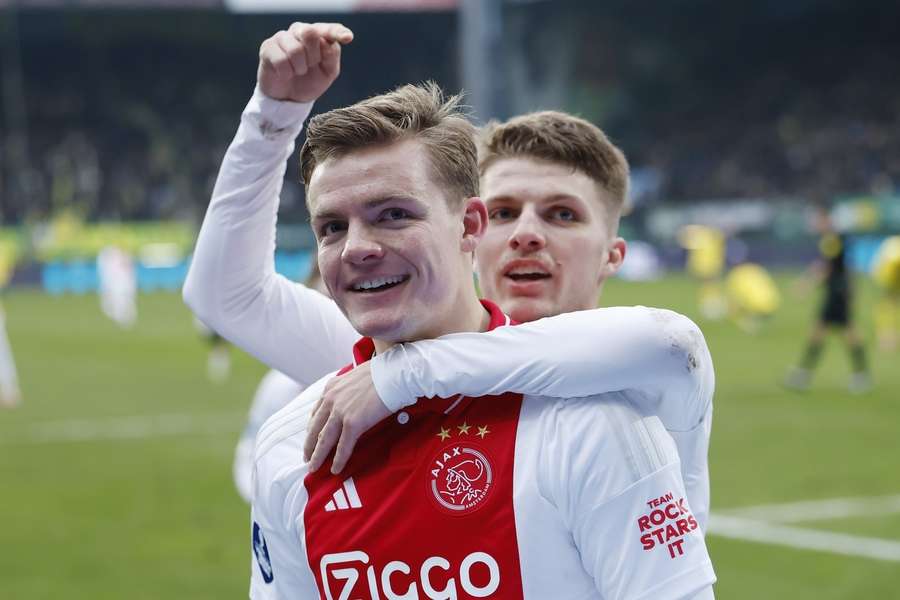 Christian Rasmussen celebrates the win with Danish countryman, Anton Gaaei 
