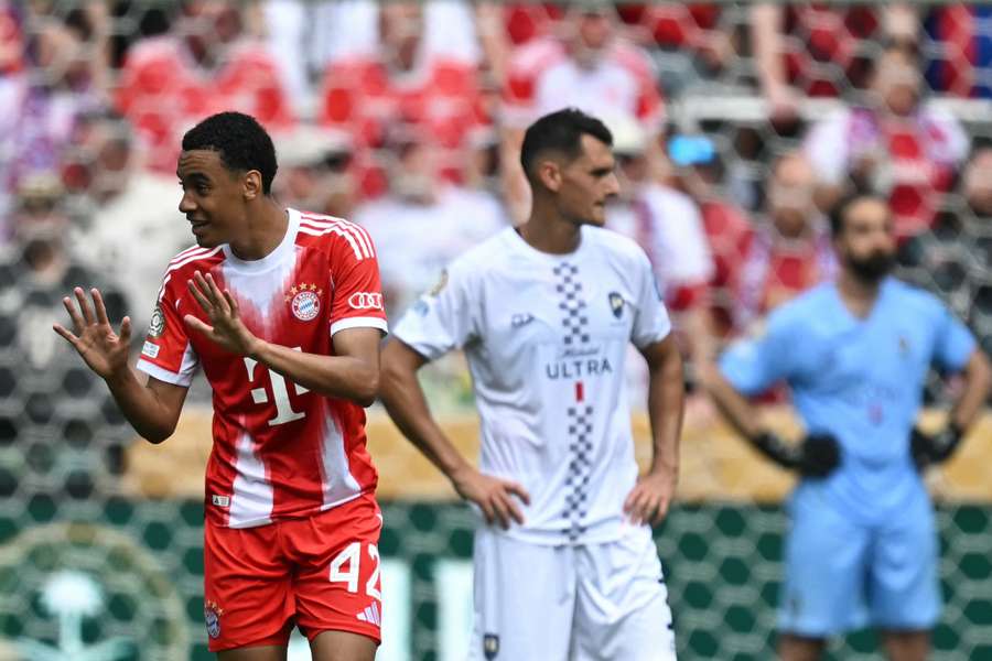 Musiala (left) celebrates scoring for Bayern