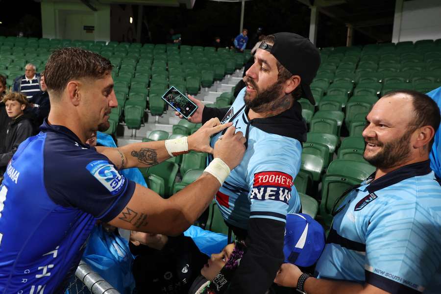 Western Force winger Zac Lomax signs a couple of NSW Origin shirts in Perth. Western Force winger Zac Lomax signs a couple of NSW Origin shirts in Perth.