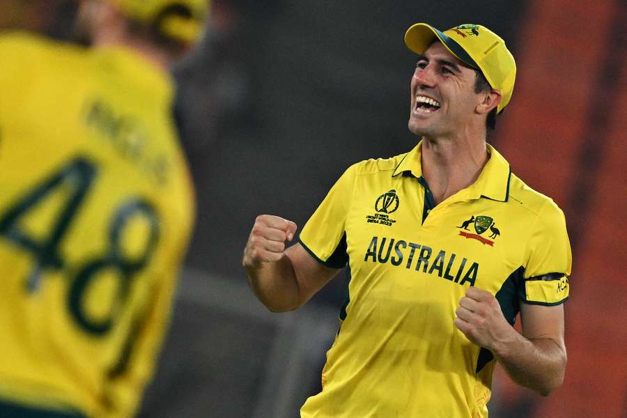 Australia's captain Pat Cummins celebrates after their win