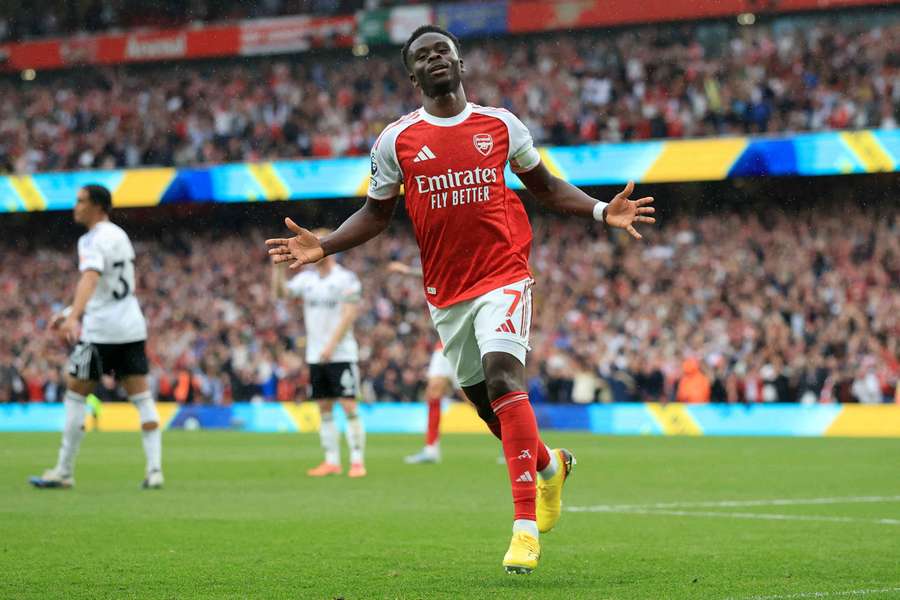 Arsenal's Bukayo Saka celebrates scoring against Fulham