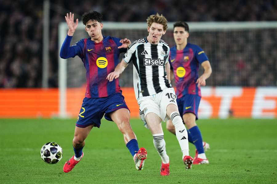 Barcelona's Marc Bernal challenges Newcastle's Anthony Gordon