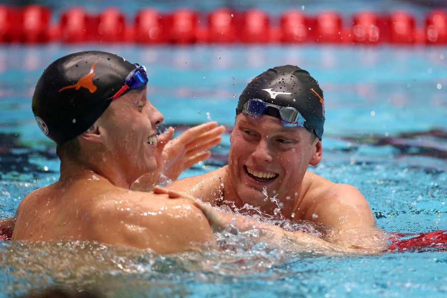 Carson Foster and Luke Hobson react after the men's 200m Freestyle final on Wednesday