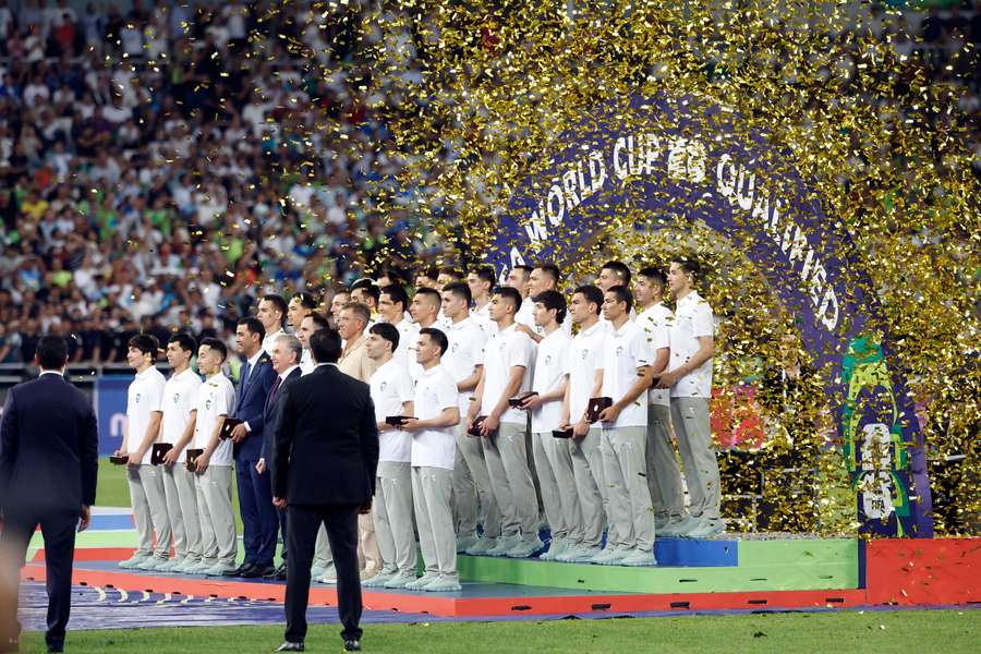 Uzbekistan President Shavkat Mirziyoyev and players pose for a picture to celebrate securing a spot at the 2026 FIFA World Cup Uzbekistan President Shavkat Mirziyoyev and players pose for a picture to celebrate securing a spot at the 2026 FIFA World Cup