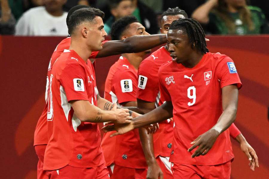 Grani Xhaka, left, congratulates Johan Manzambi after his assist for Switzerland's first goal Grani Xhaka, left, congratulates Johan Manzambi after his assist for Switzerland's first goal