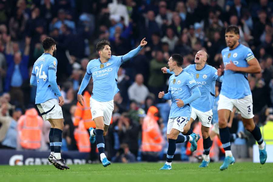 John Stones celebrates scoring Man City's last-gasp equaliser