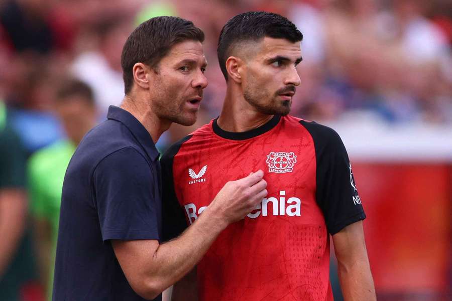  Bayer Leverkusen's Martin Terrier with coach Xabi Alonso before coming on as a substitute