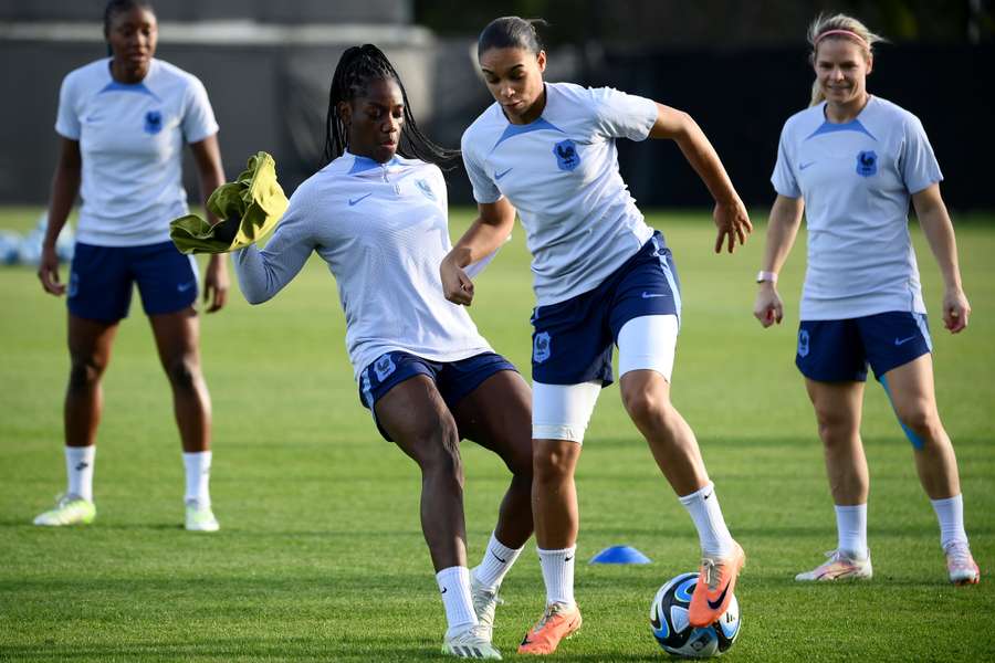 Estelle Cascarino fights for the ball with fellow defender Aissatou Tounkara during a training session