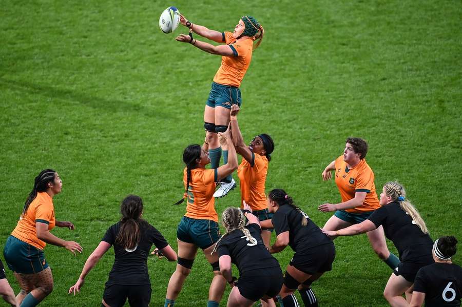 Chancellor (top) is held aloft by her Australia teammates