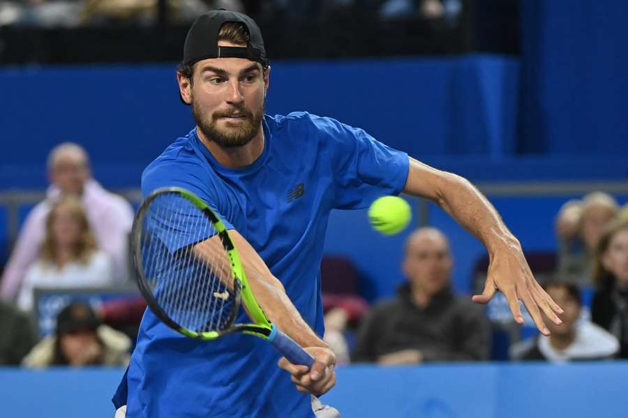 USA's Maxime Cressy returns the ball to Denmark's Holger Rune during their men's semi-final singles tennis match 