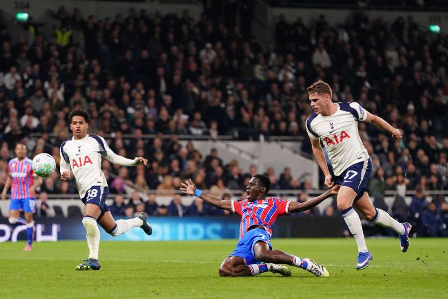 Tottenham's Micky van de Ven concedes a penalty by fouling Crystal Palace's Ismaila Sarr