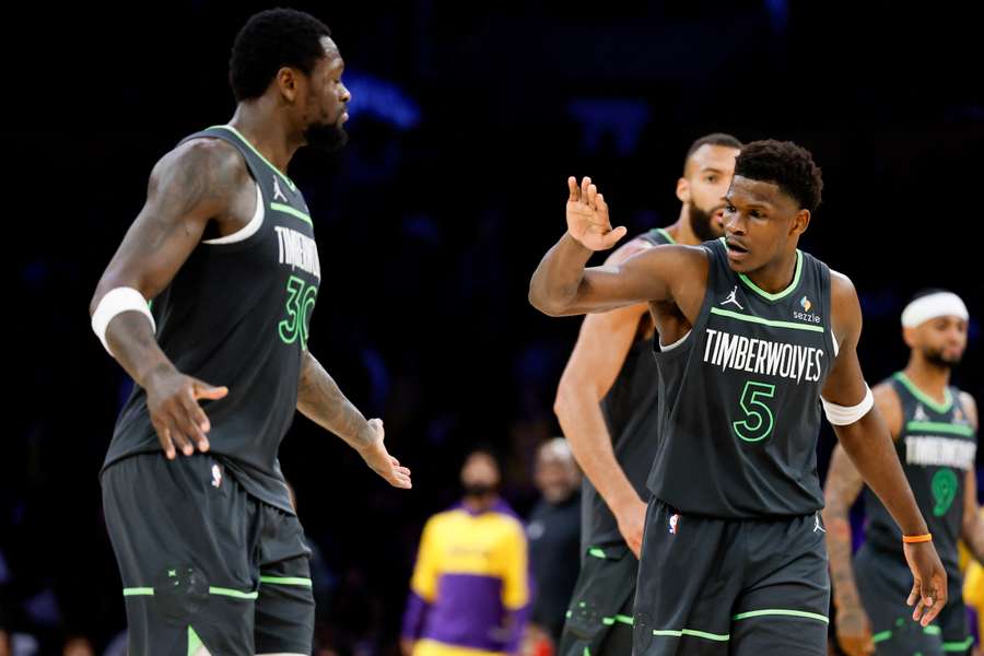 Anthony Edwards and Julius Randle of the Minnesota Timberwolves high-five during the fourth quarter against the Los Angeles Lakers