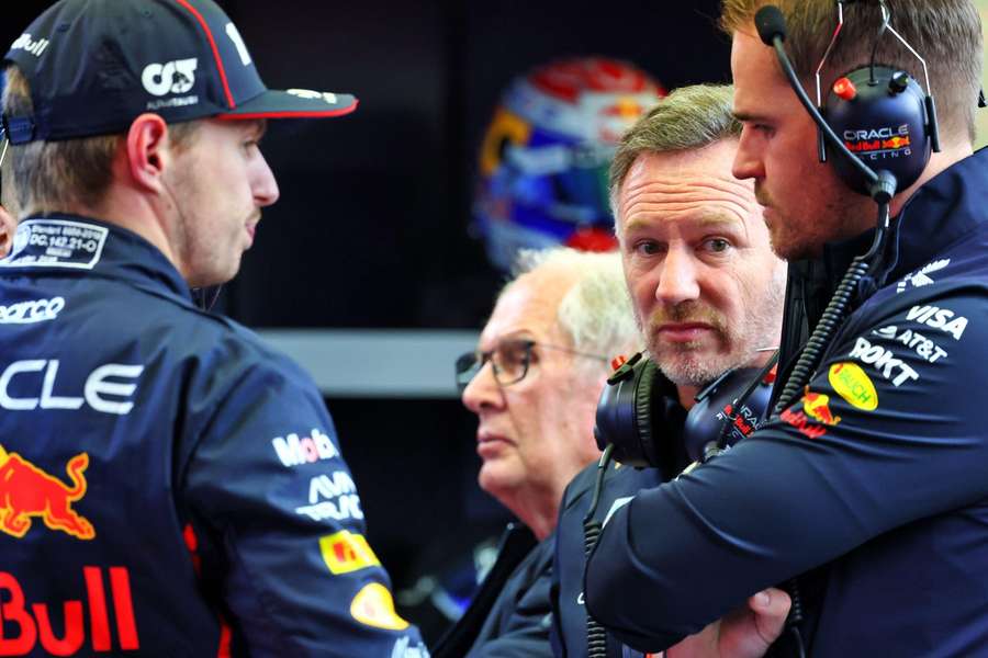 Horner alongside Verstappen (L)