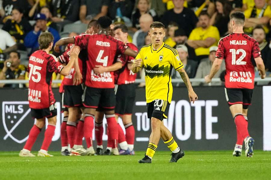 Columbus Crew midfielder Alexandru Matan reacts as New York Red Bulls midfielder Felipe Carballo celebrates scoring