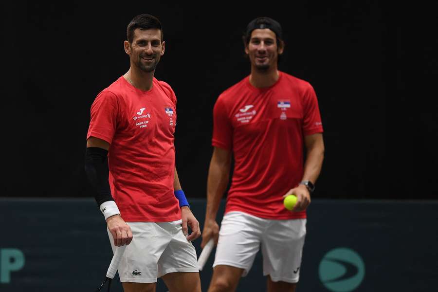 Djokovic, left, takes part in a training session