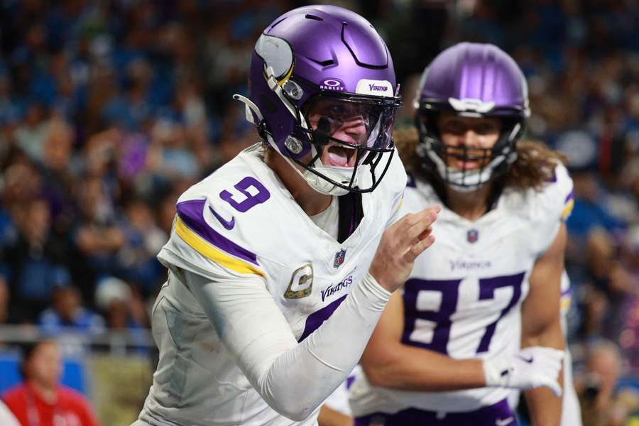 Vikings QB J.J. McCarthy celebrates after a touchdown against the Lions in Week 9 of the 2025 NFL Season