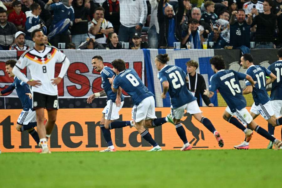 Greece's Dimitrios Kourbelis celebrates his goal with teammates Greece's Dimitrios Kourbelis celebrates his goal with teammates