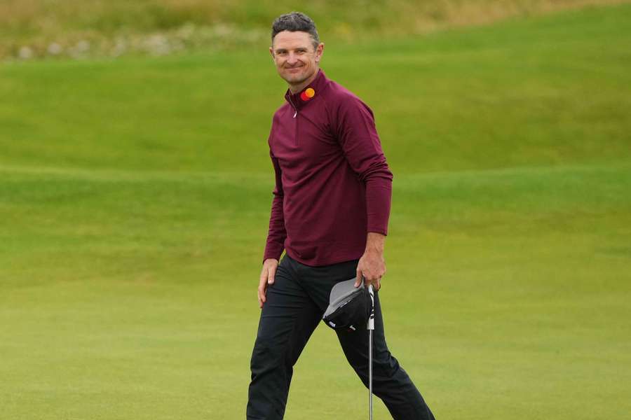 England's Justin Rose reacts on the 18th green after finishing his final round 