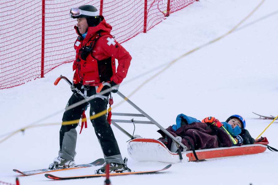 Mikaela Shiffrin of the United States is taken off the course on a sled