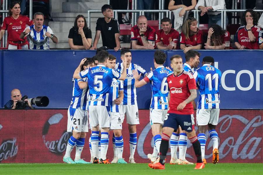 Real Sociedad players celebrate the opening goal